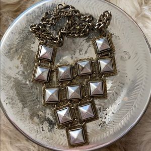 Silver studded necklace.